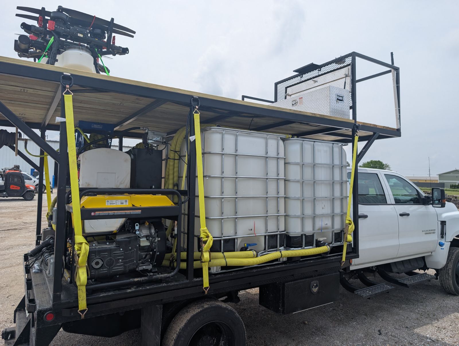 Field support rig loaded with totes, generator and aircraft on the deck