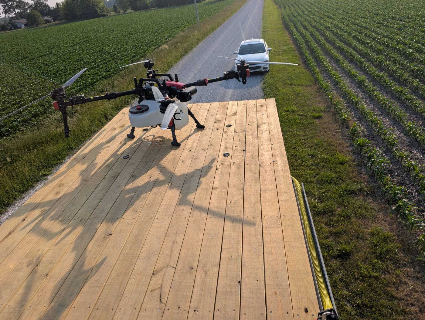 XAG P150 on trailer deck at a cornfield edge