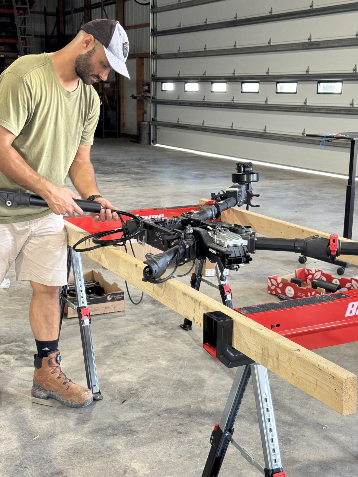 Ben repairing an XAG P150 in the Drone Allies shop
